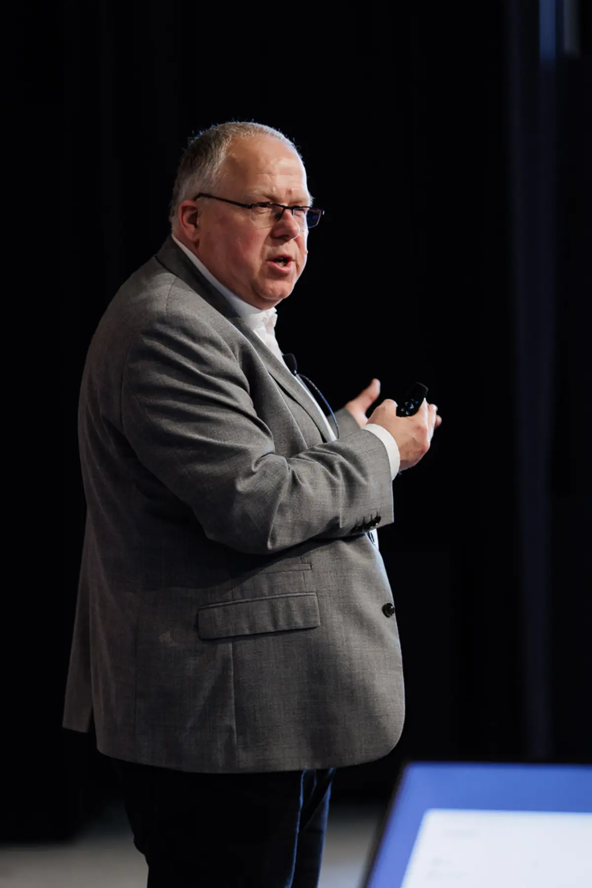 Malcolm Staves speaking on stage